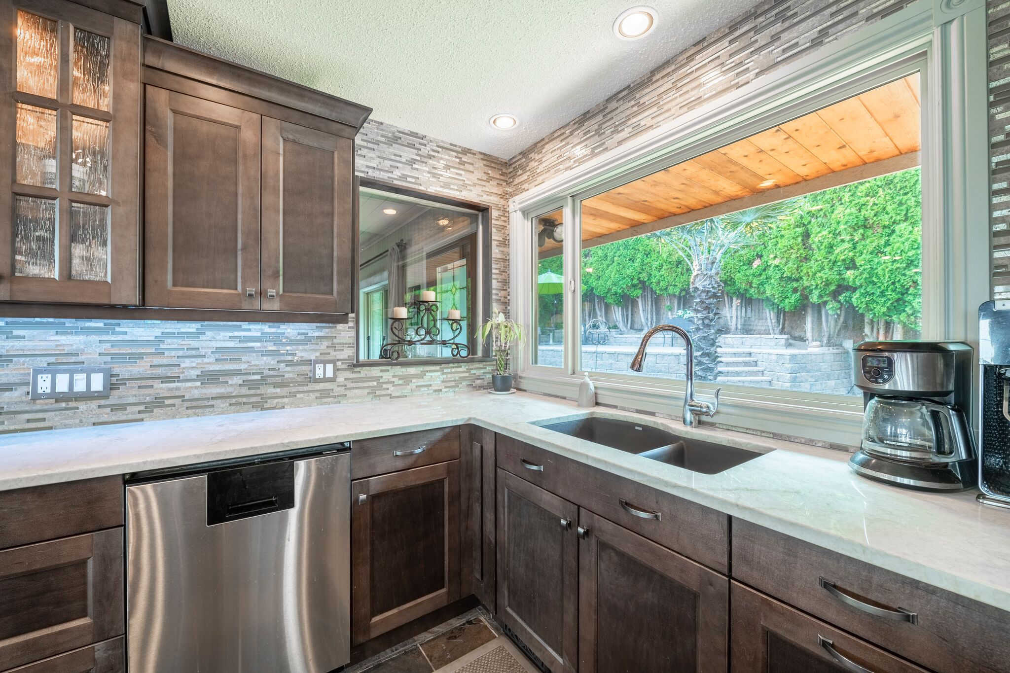 Kitchen with marble counters and pendant lighting
