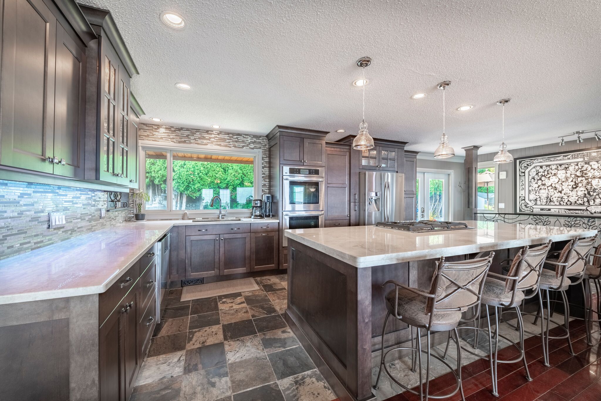 Full private kitchen with island and stainless appliances
