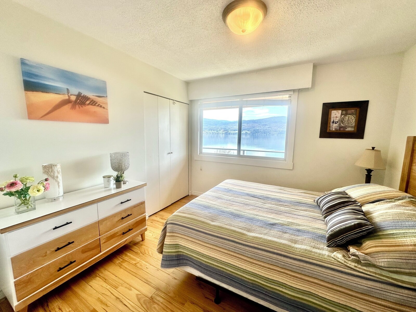 Bright bedroom with lake view window